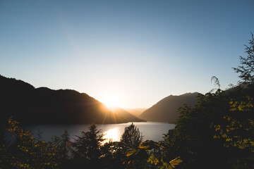 sunset over mountains at lake cushman, washington, pacific northwest