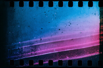 Blank grained and scratched film strip texture background. old film effect