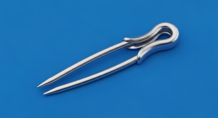 Shiny Silver Safety Pin on Blue Background