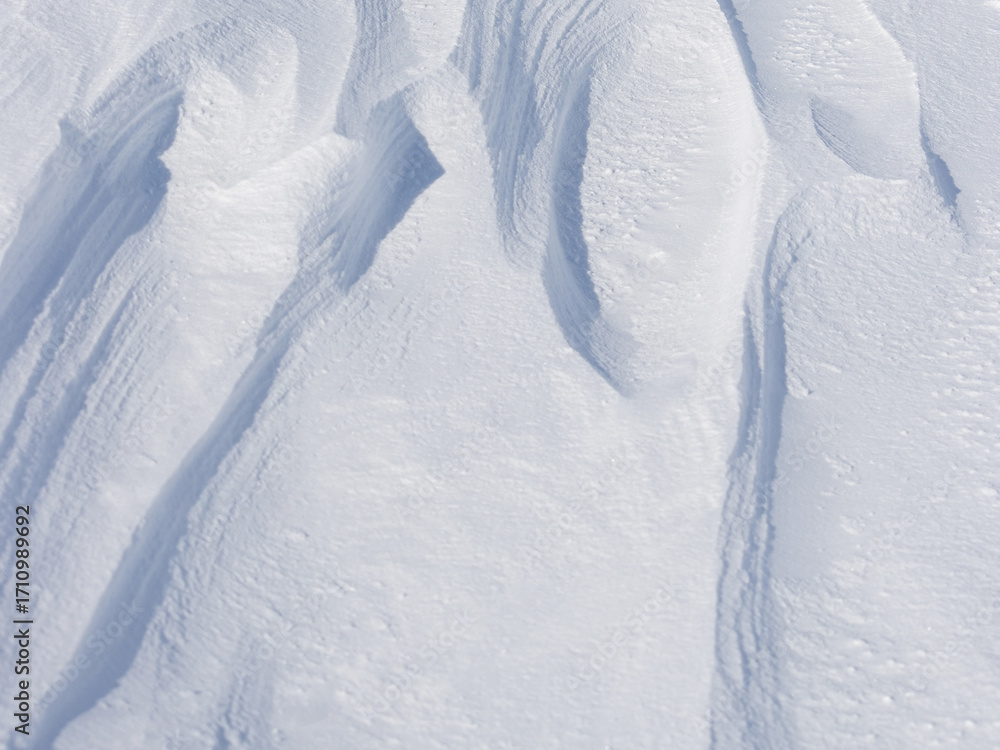 Sticker snow texture. wind sculpted patterns on snow surface. wind in the tundra and in the mountains on the