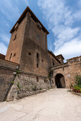 Obraz premium Valldemossa, Spain - June 10, 2025: A delightful summer scene in the village of Valldemossa on Mallorca. A popular destination for tourists.