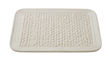 Rectangular cream-colored mat with textured pattern