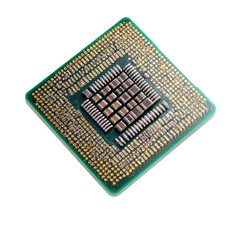 Close-up of a computer processor.  Square, green circuit board with numerous metallic components.  Gold contacts visible.  High-tech electronic component