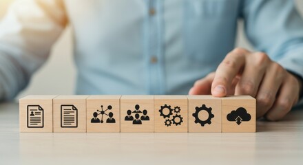 Concept of cloud computing and business process management illustrated with icons on wooden blocks