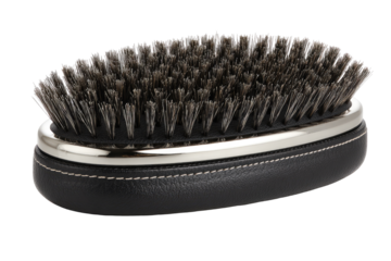 Oval-shaped black leather hairbrush with silver trim.  Grey bristles