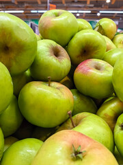 Fresh Green Apples Piled High in a Market Display