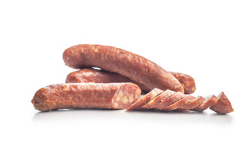 Sliced smoked ​​sausage isolated on white background.