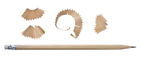 Close-up of wooden pencil with sharpened tip and shavings, isolated background