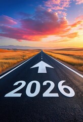 A winding road leads toward a horizon marked by vibrant skies, symbolizing hope and new beginnings for 2026.