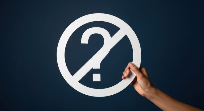 Hand holding a white forbidden question mark sign. Problem-solving or solution concept. No problem or ban on questions theme.