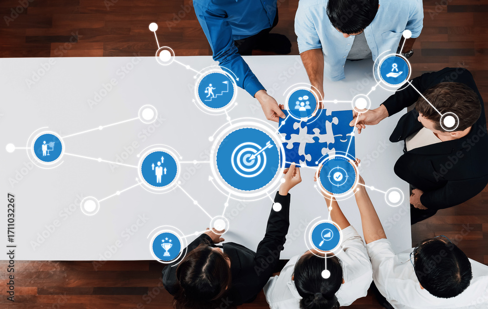 Poster a business team collaboratively solving a puzzle symbolizing strategy and goals, utilizing digital t