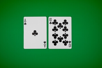 Blackjack hand on green background, symbolizing casino games, gambling, and poker tournaments.