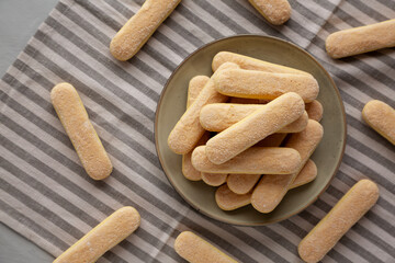Savoiardi biscuits on a plate, top view.