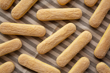 Savoiardi biscuits on a plate, top view. Close-up.