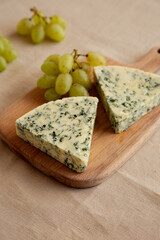 Delicious Cheese Danablu on a wooden board, side view.