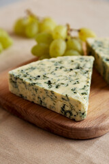 Delicious Cheese Danablu on a wooden board, side view.