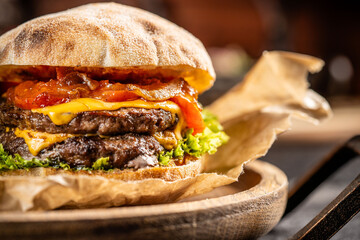 Juicy double cheeseburger with fresh vegetables.