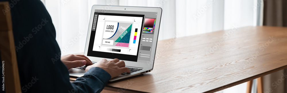 Poster graphic designer software for modern design of web page and commercial ads showing on the computer s