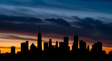Naklejka premium Silhouette of New York skyline with towers, dramatic cityscape highlighting iconic architecture.