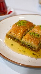 Traditional Turkish Baklava with Pistachio and Honey Syrup Served on Plate for Premium Sweet Dessert Object and Gourmet Pastry Concept