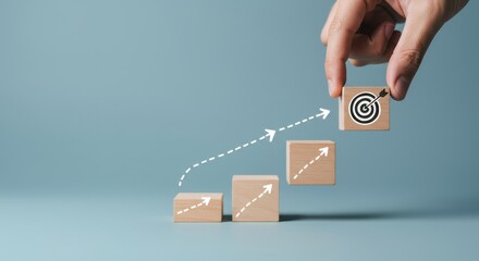 Conceptual image of a hand placing a wooden block with a target symbol on top of a rising graph, symbolizing business growth and goal achievement