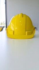 Yellow Safety Helmet for Construction Worker on Table for Premium Tool Object and Industrial Safety Concept