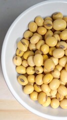 Yellow Soybeans in Ceramic Bowl for Premium Healthy Food Object and Organic Plant Protein Concept