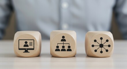 Wooden blocks with icons representing business concepts remote work, team hierarchy, and network connections