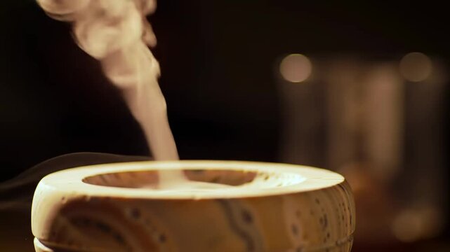 Elegant stone aroma diffuser releasing fragrant mist, creating a serene atmosphere for wellness and relaxation