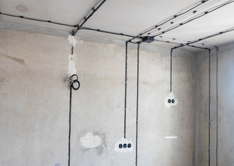 work piece with repair tools, ladders, dangling cables or wires hanging down