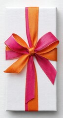 Elegant white gift box adorned with a striking pink and orange ribbon bow.