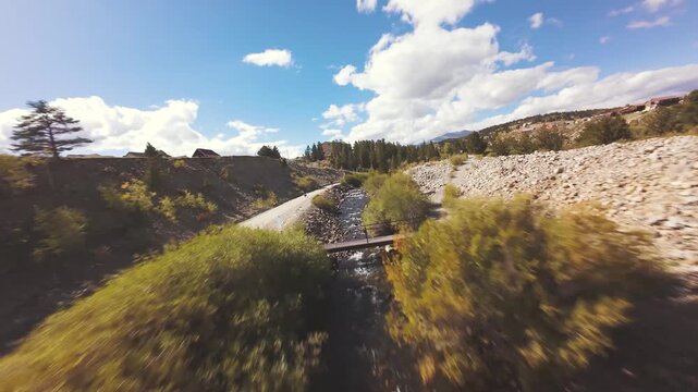 Aerial FPV flight above river and fall aspen grove, FPV video, Fairplay, Colorado., 4K