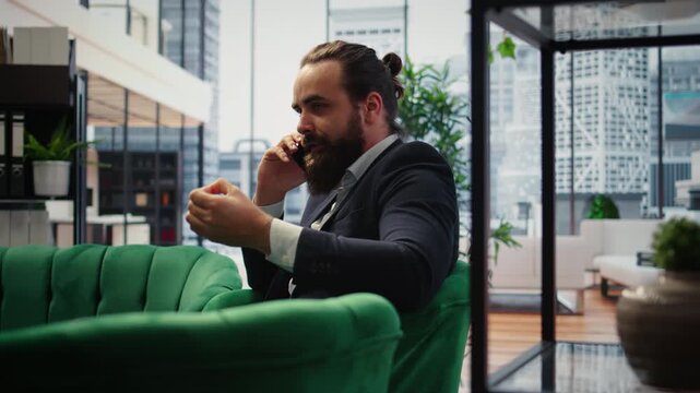 Unsatisfied irritated leader scolding his assistant on a telephone call, criticizing the ineffective team and showcasing incompetence in managing a corporation. Difficult relations. Camera A.
