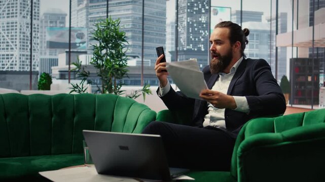 Rude furious director yelling at his partners on teleconference call, screaming and accusing them of incompetence. Aggressive irritated boss throwing documents around, difficult relations. Camera A.