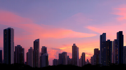 Obraz premium Stunning skyline featuring towering buildings against vibrant sunset, showcasing blend of modern architecture and natural beauty. colors of sky create serene atmosphere