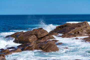 waves crashing on rocks