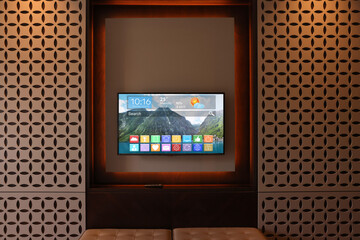 TV set showing menu with icons and information on display in room