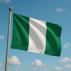 Nigeria’s green and white flag waves proudly under a bright blue sky with clouds.