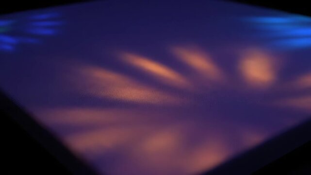 Psychedelic multi-colored light patterns ebb and flow across a vibrant, hypnotic abstract canvas in a seamlessly looping video graphic, loop, abstract canvas