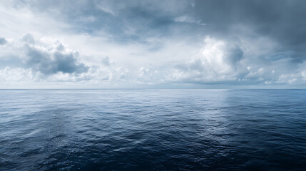 Wide seascape with horizon and cloudy blue sky – ocean background for design and presentation