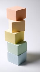 Obraz premium Colorful stacked cubes on white background