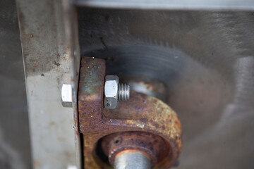 rusty bolt and nut on the truck, closeup of photo