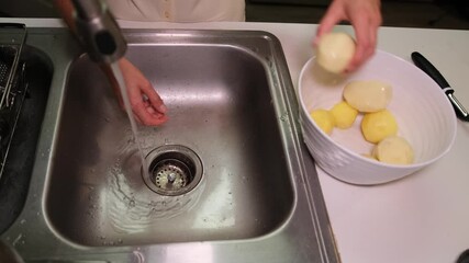 Washing Potatoes in the Kitchen Sink for Your Delicious Dishes and Culinary Adventures