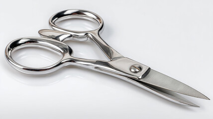 Obraz premium Scissors with black handles placed on a wooden surface.