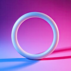Obraz premium A simple white torus ring object illuminated by dramatic studio lighting against a vibrant gradient background.
