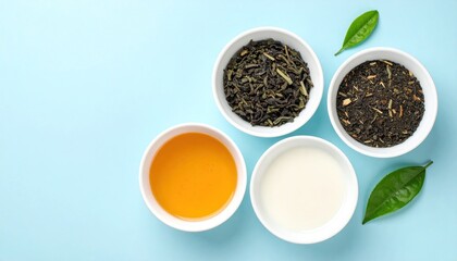 Four bowls - loose leaf tea, tea blend, amber liquid, white liquid- & scattered leaves, all against a baby-blue background, shot from overhead