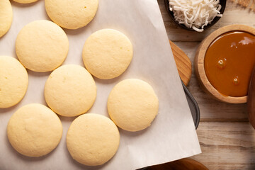 Alfajores cookies. A traditional dessert popular in Latin America, it consists of two cookies sandwiched together with dulce de leche, topped with powdered sugar or shredded coconut.