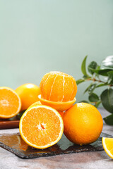 Fresh Orange Citrus Fruits on Wooden Board with Green Leaves - Healthy Vitamin C Food Photography