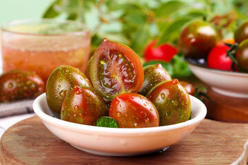 Fresh Heirloom Cherry Tomatoes with Water Droplets in White Bowl - Healthy Organic Vegetables