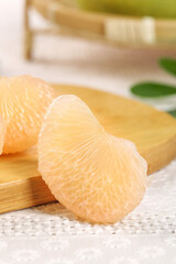 Fresh Pomelo Citrus Fruit Segments on Wooden Board - Healthy Sweet Juicy Asian Grapefruit